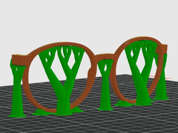 3D-gedruckte Brillenfassungen in Grün vor einem Modell